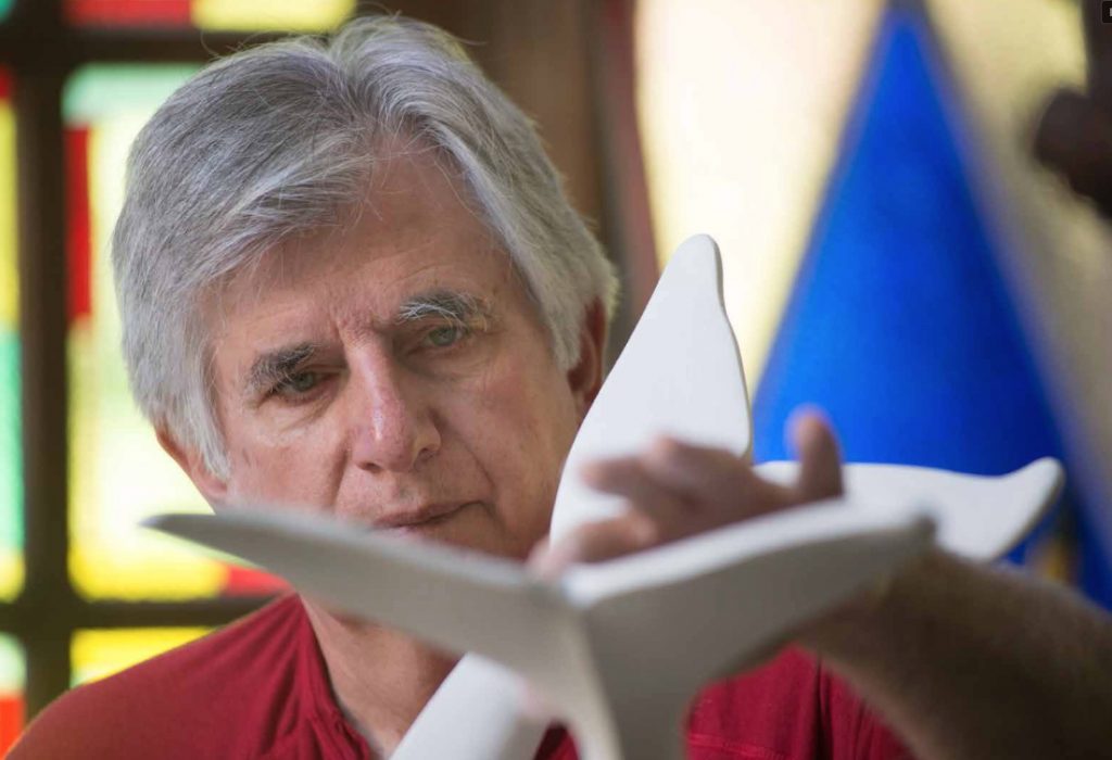 Nearly 40 years ago, sculptor Jim Sardonis had a dream. He saw himself standing on the shore watching two whales dance in the surf. The image of the pair of tails breaking the surface of the water as they dove into the depths of the ocean was frozen in his mind.
The product of that dream, a sculpture of twin whales’ tails superimposed against the Green Mountains, will soon grace the Randolph landscape once more....